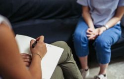 Psychotherapy session, woman talking to his psychologist in the studio